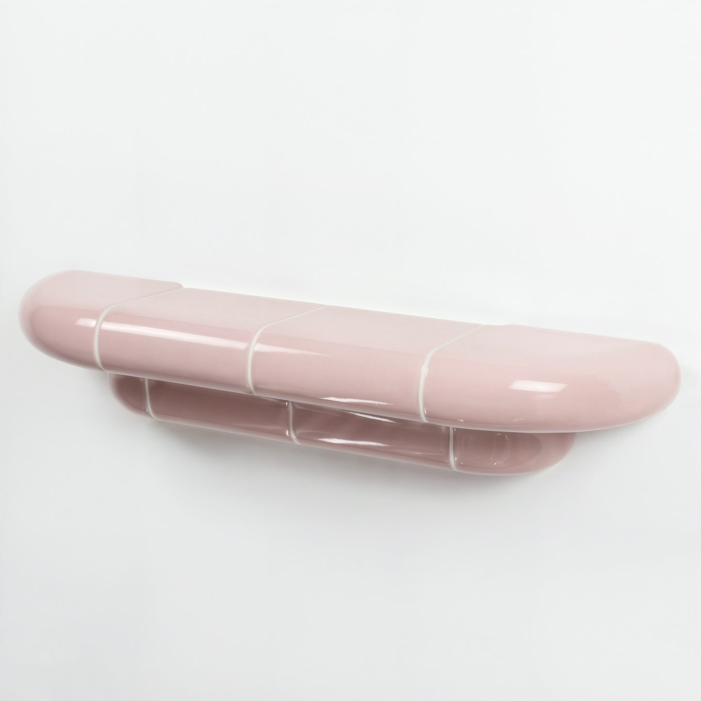 Orbi floating wall shelf in glossy Blush Pink finish, handcrafted in Spain.