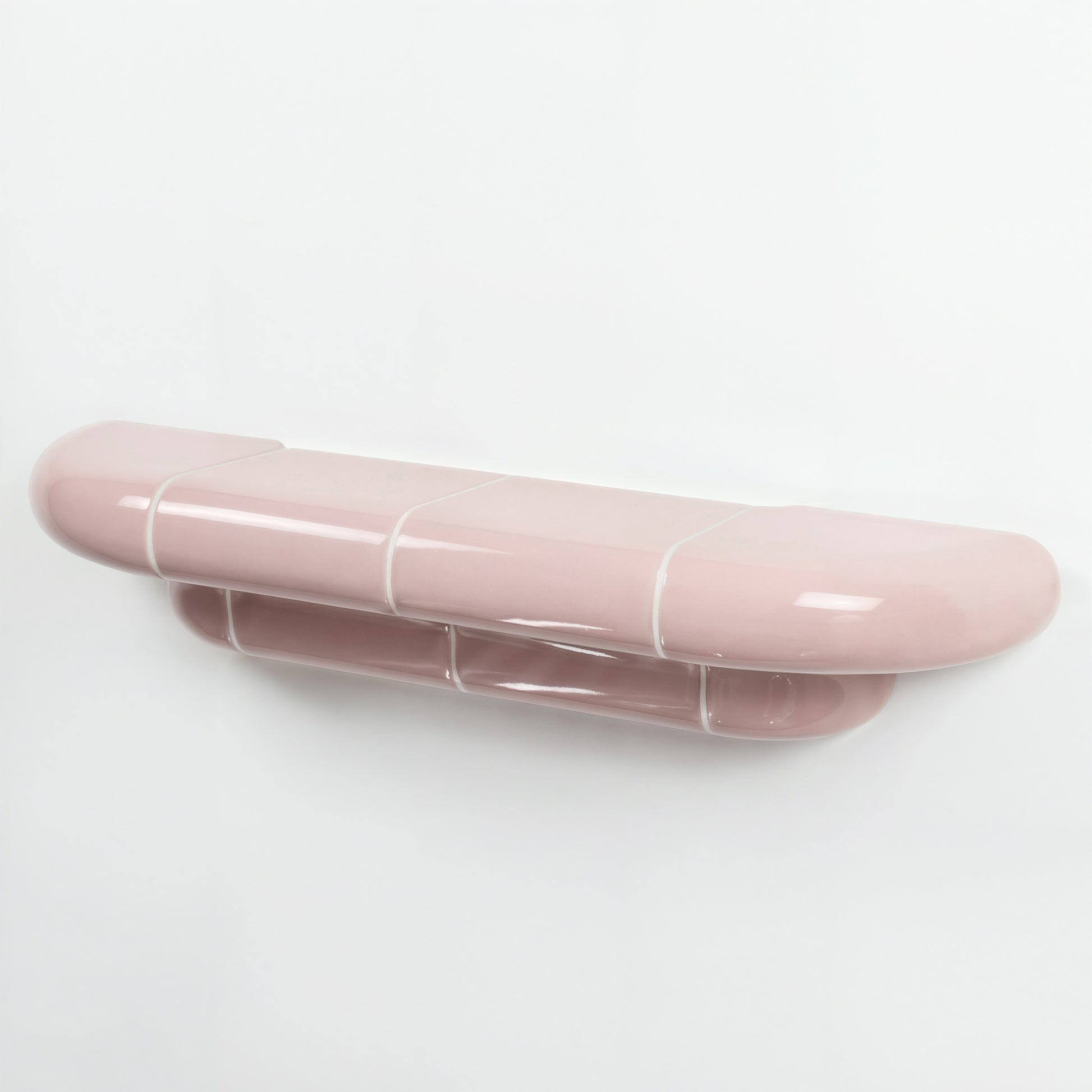 Orbi floating wall shelf in glossy Blush Pink finish, handcrafted in Spain.
