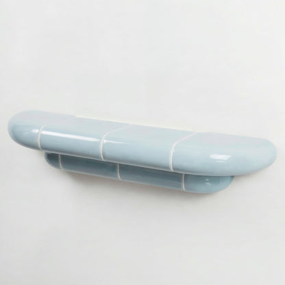 Orbi floating wall shelf in glossy Ice Blue finish, handcrafted in Spain.