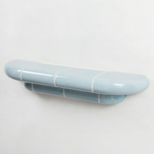 Orbi floating wall shelf in glossy Ice Blue finish, handcrafted in Spain.