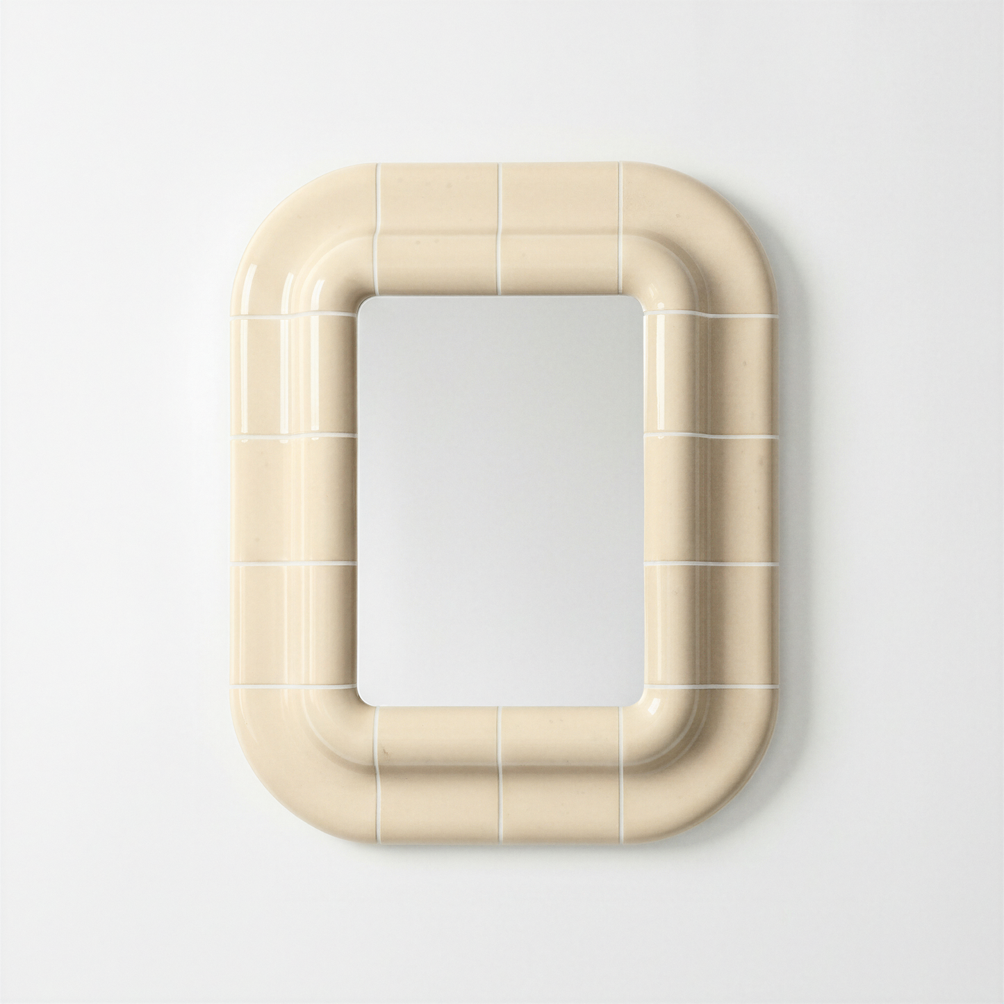 Soft Butter ceramic-look mirror with a rounded rectangular shape, shown frontally against a neutral background.