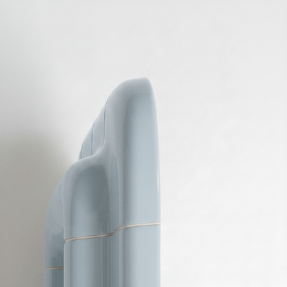 Side view of the Ice Blue ceramic-look mirror showing frame depth and curved profile.