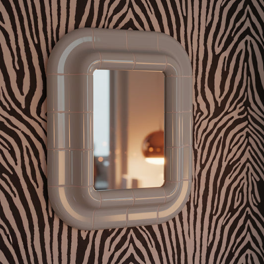 Ice Blue ceramic-look mirror shown in angled perspective, highlighting rounded edges and glossy finish.