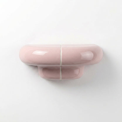 Orbi XS designer floating shelf in glossy Blush Pink, compact handcrafted shelf for contemporary interiors.