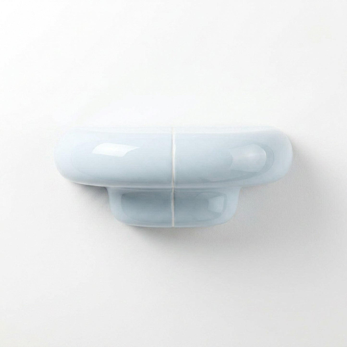 Orbi XS designer shelf in glossy Ice Blue, compact floating shelf for modern spaces.