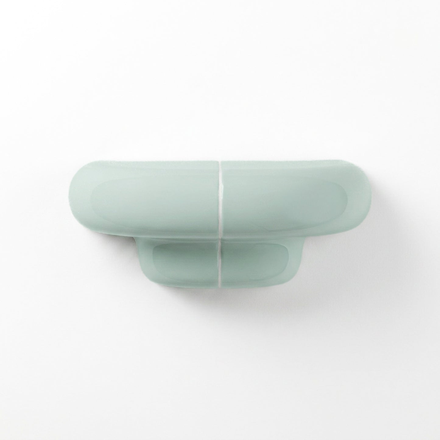 Orbi XS floating wall shelf in glossy Pastel Mint, modern handcrafted shelf for contemporary interiors.