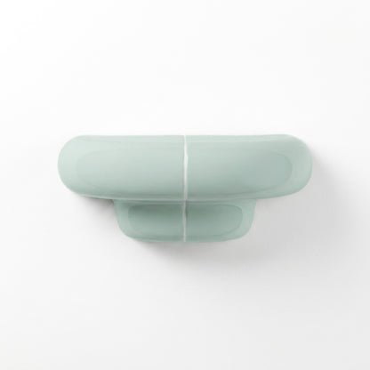 Orbi XS floating wall shelf in glossy Pastel Mint, modern handcrafted shelf for contemporary interiors.