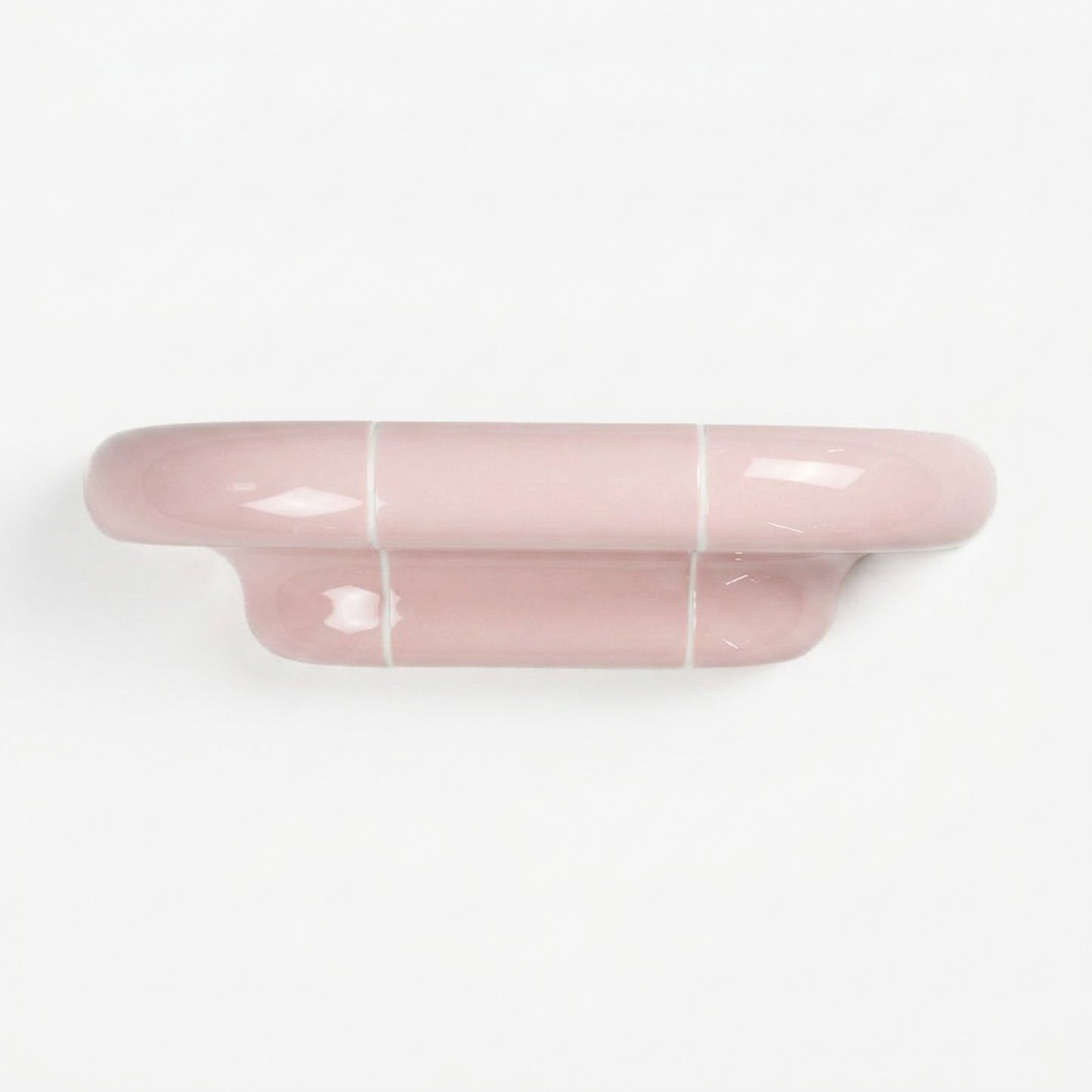 Orbi S modular wall shelf in glossy Blush Pink with sculptural ceramic-inspired design.