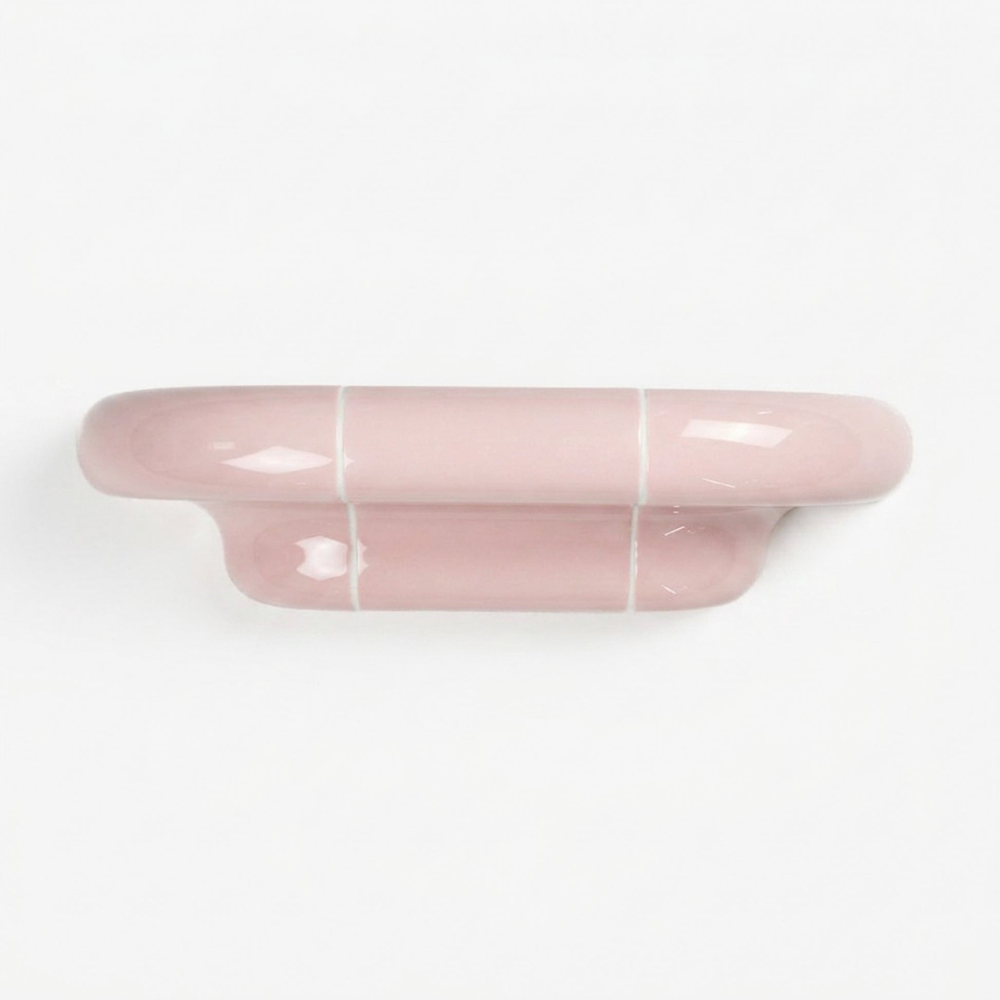 Orbi S modular wall shelf in glossy Blush Pink with sculptural ceramic-inspired design.
