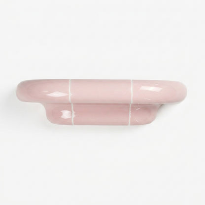Orbi S modular wall shelf in glossy Blush Pink with sculptural ceramic-inspired design.