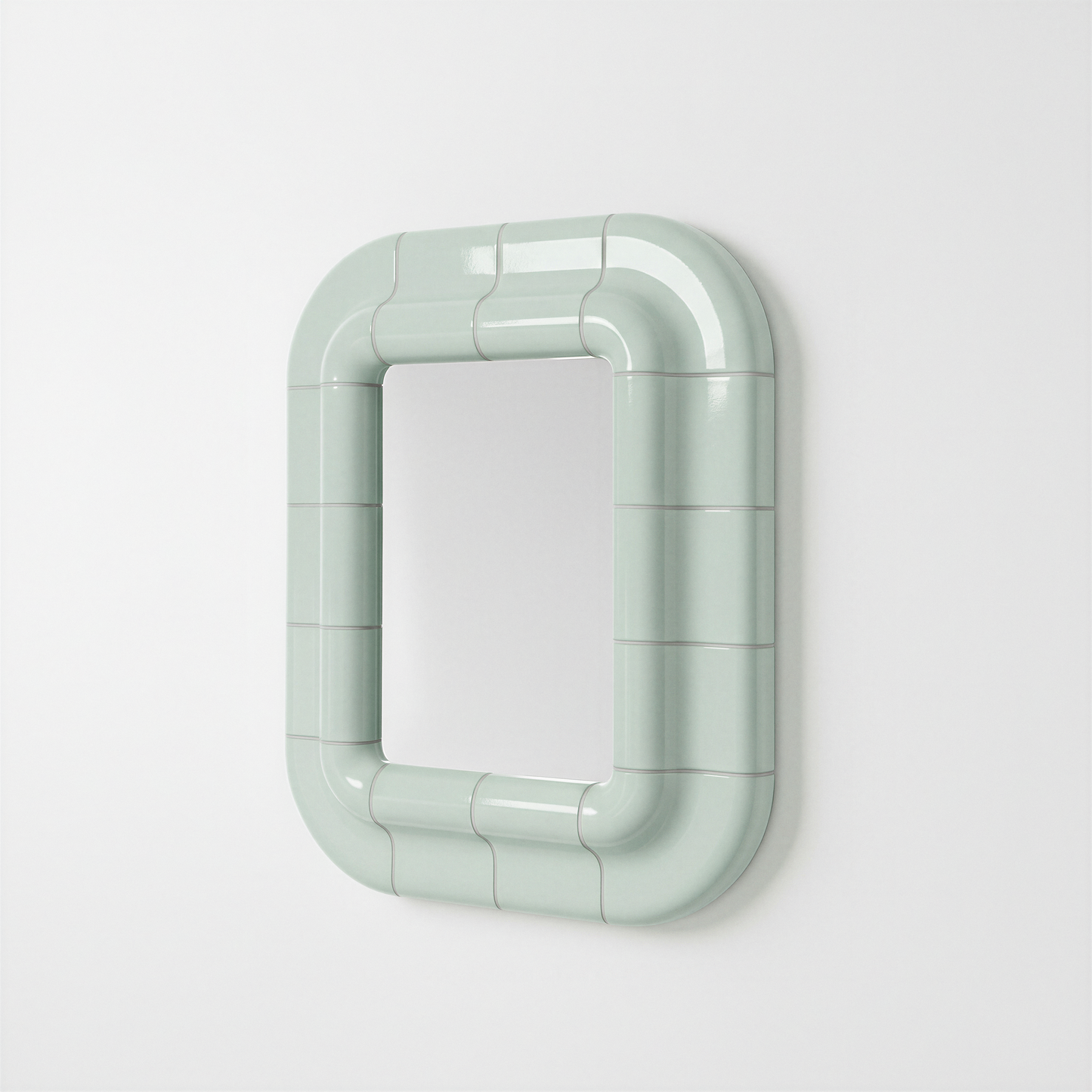 Soft Mint ceramic-look mirror shown in angled perspective, highlighting its sculptural frame.