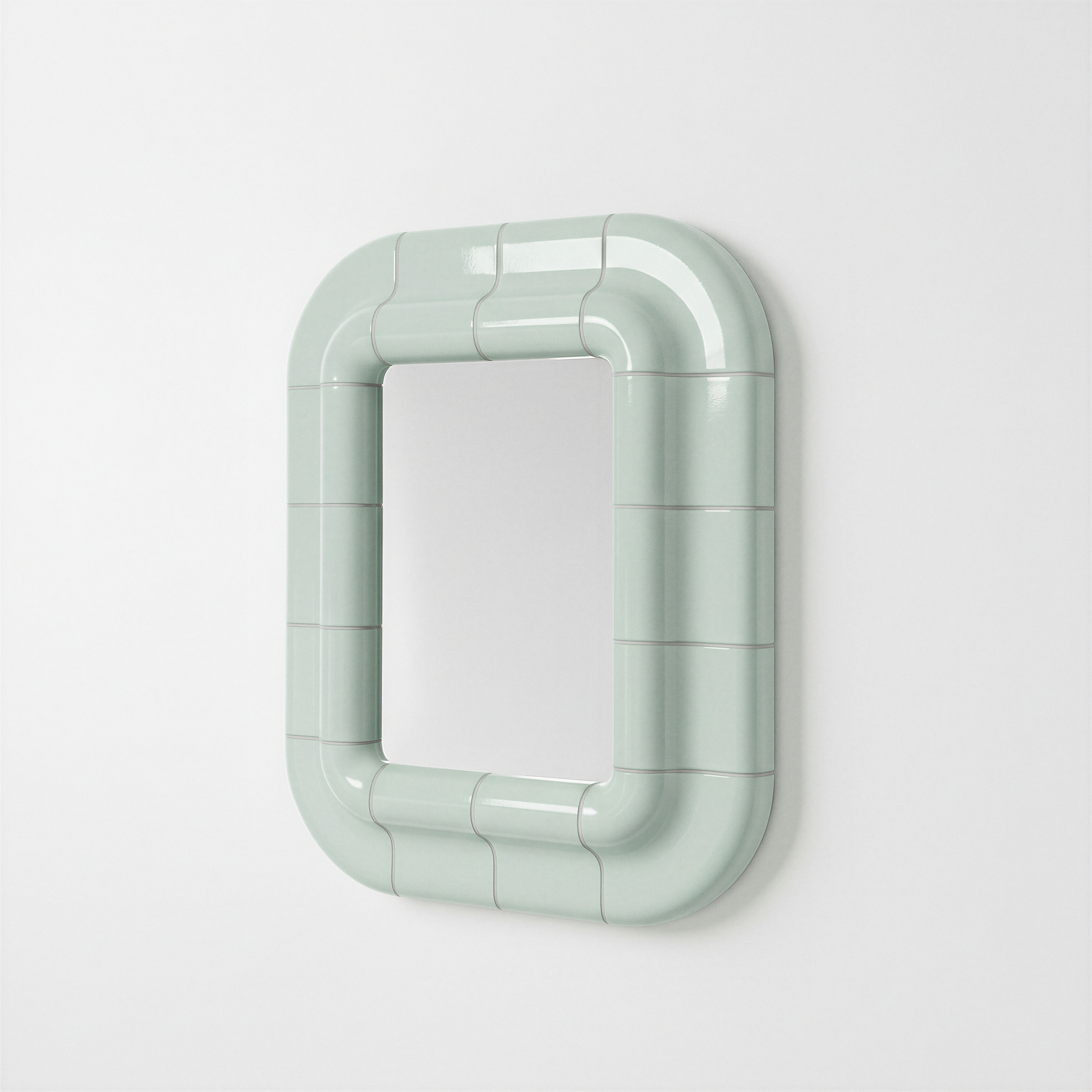 Soft Mint ceramic-look mirror shown in angled perspective, highlighting its sculptural frame.