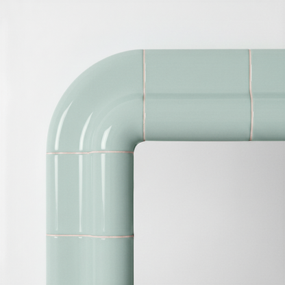 Close-up detail of the Soft Mint ceramic-look frame showing the curved corner and glossy finish.