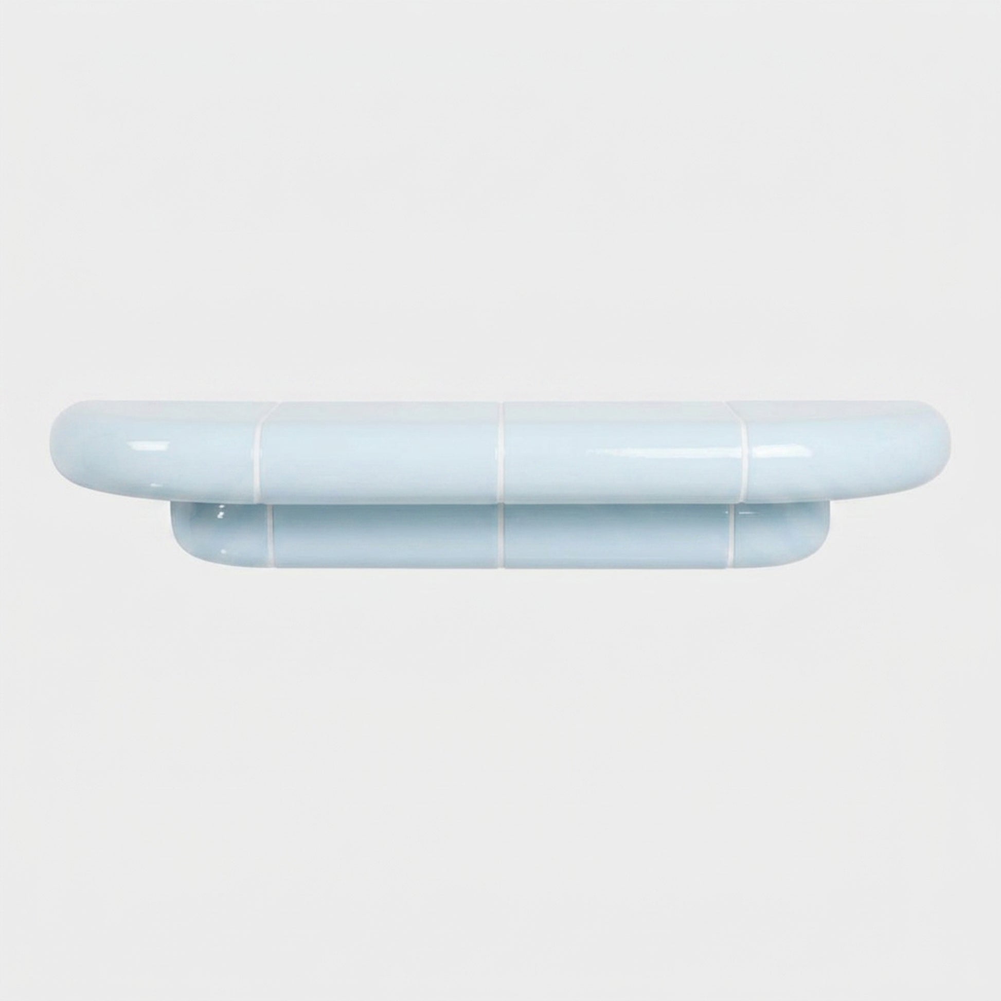 Orbi M wall shelf in glossy Ice Blue, sculptural shelf inspired by ceramic tiles.