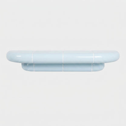 Orbi M wall shelf in glossy Ice Blue, sculptural shelf inspired by ceramic tiles.