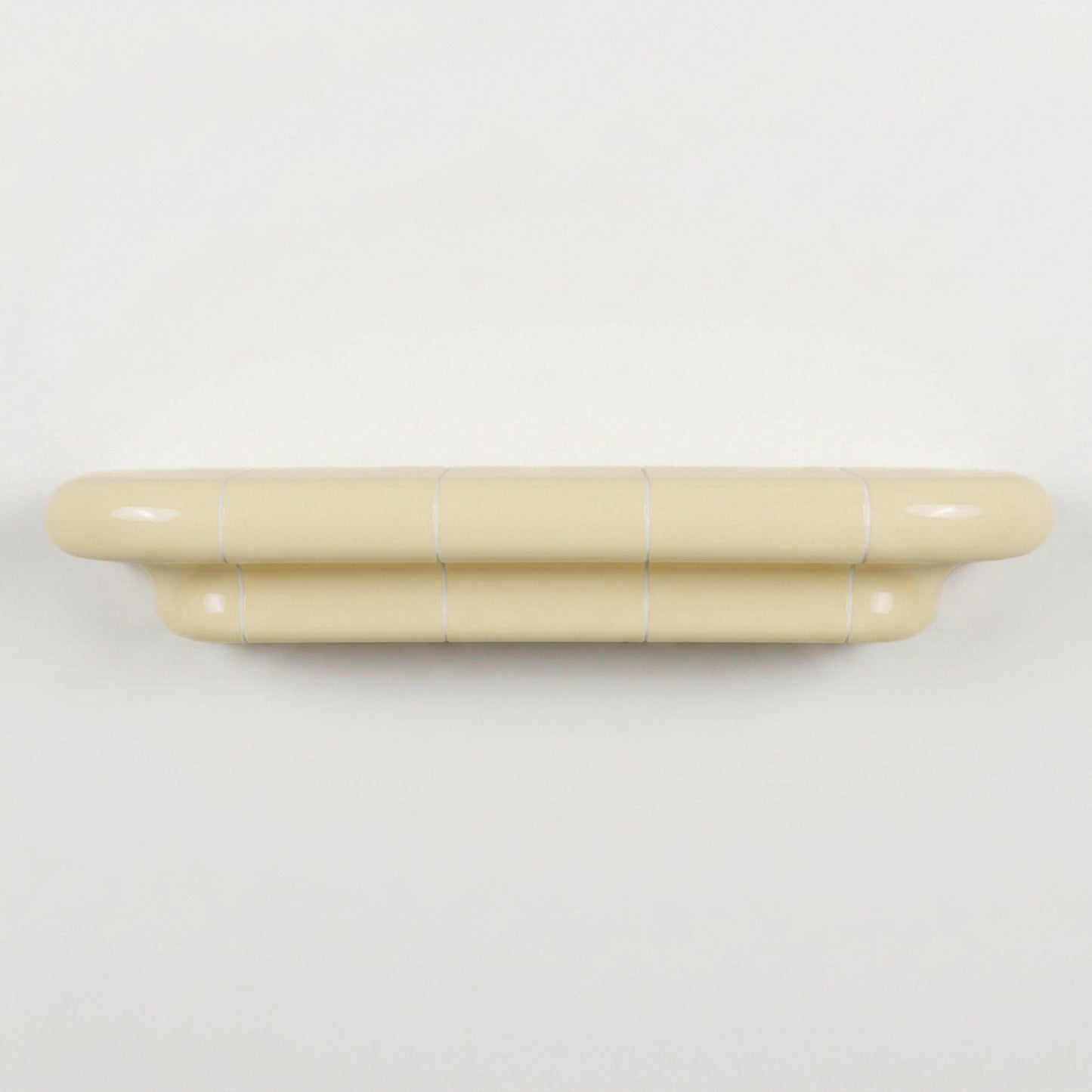 Orbi L contemporary wall shelf in glossy Soft Butter, modular handcrafted design.
