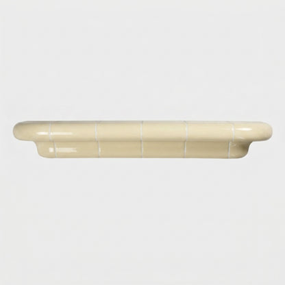 Orbi XL floating shelf in glossy Soft Butter, statement wall shelf for modern interiors.