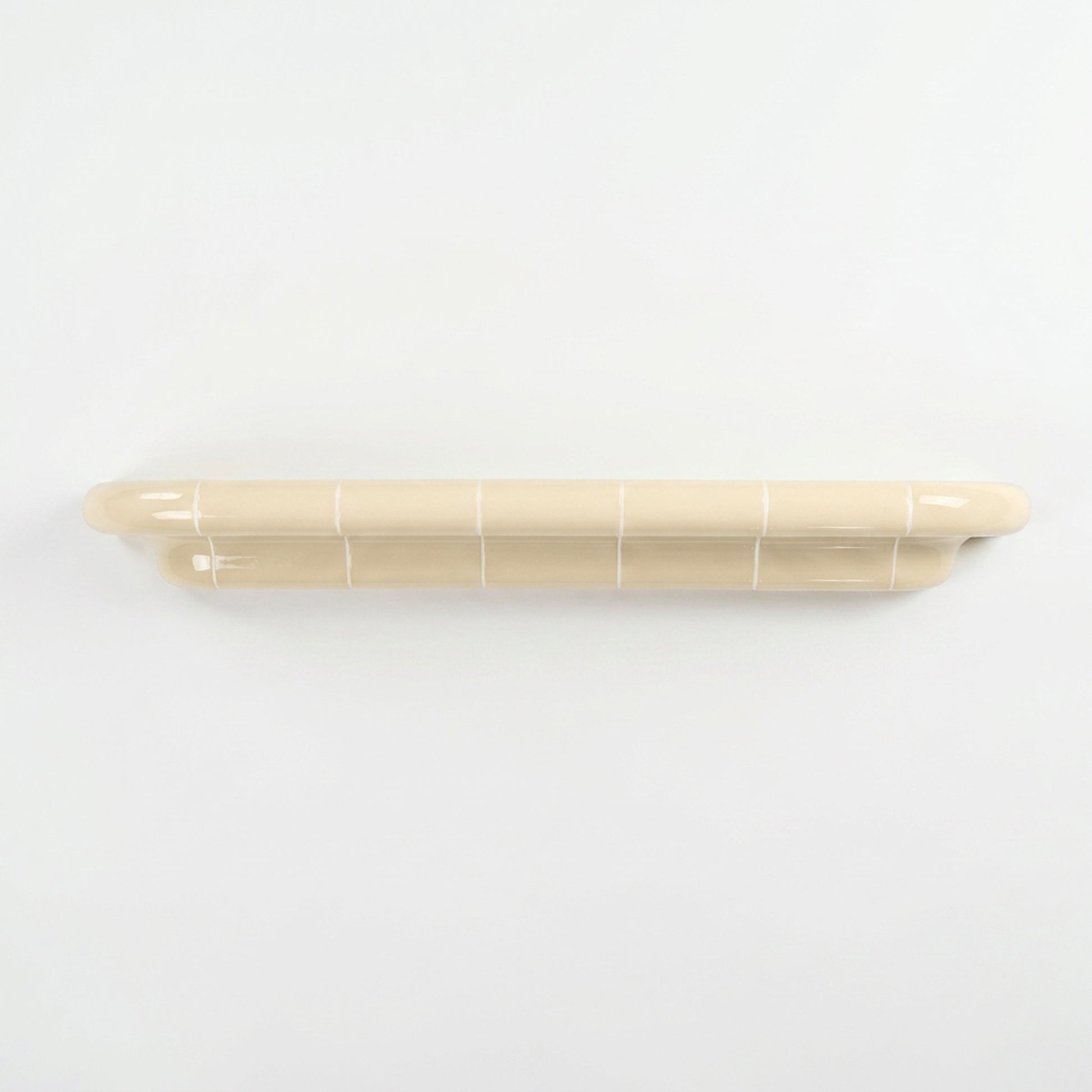 Orbi XXL extra-long floating shelf in glossy Soft Butter, handcrafted modular wall shelf.