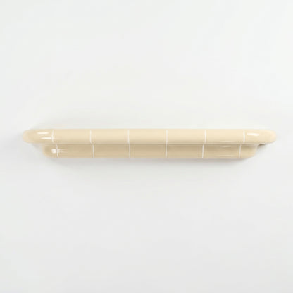 Orbi XXL extra-long floating shelf in glossy Soft Butter, handcrafted modular wall shelf.