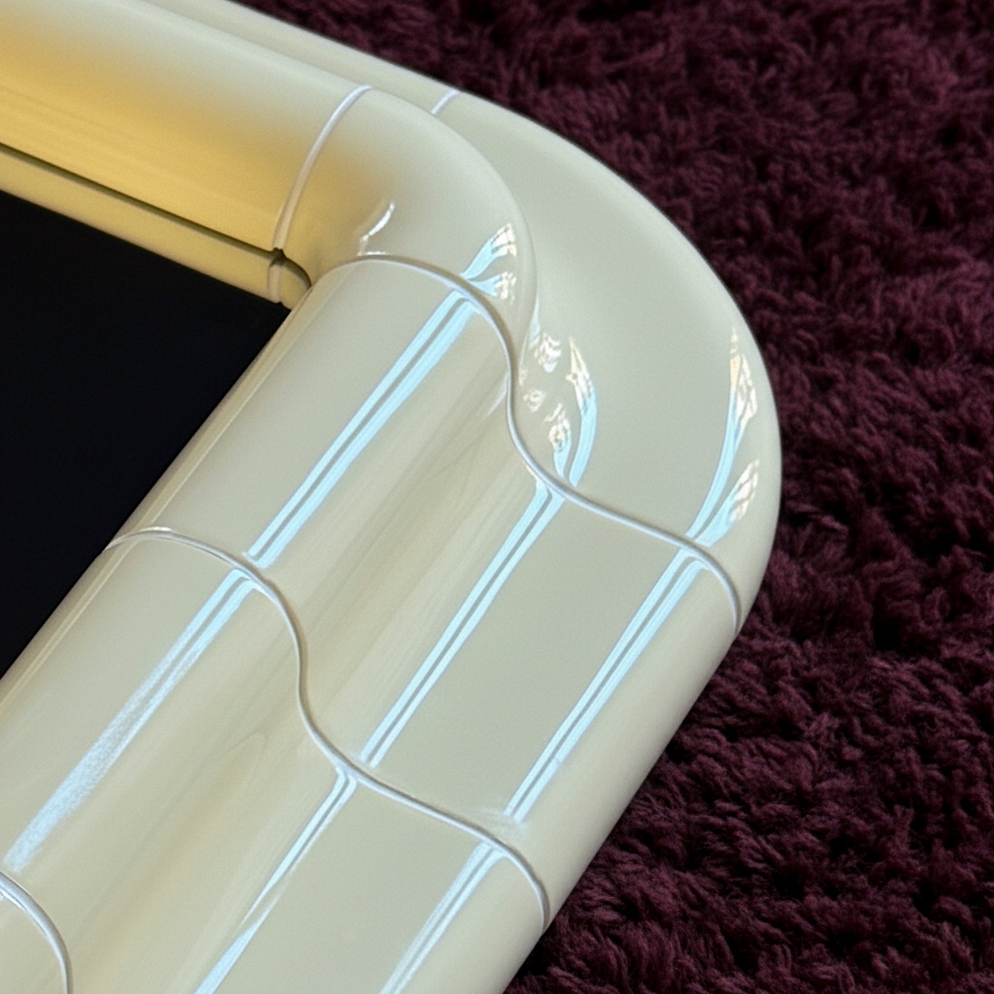 Close-up detail of the Soft Butter ceramic-look surface, showing subtle joints, gloss, and handcrafted texture.