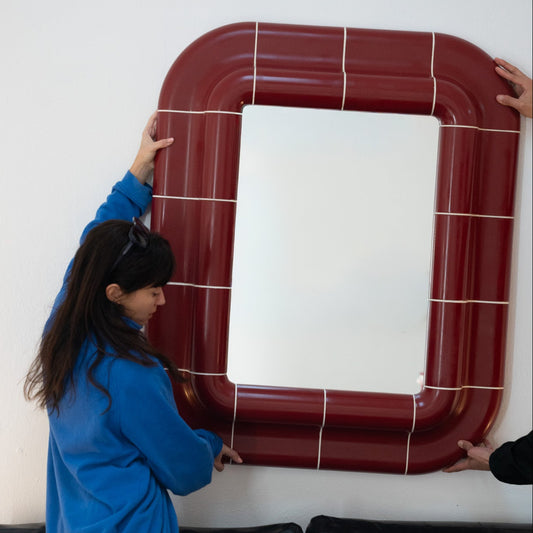 Lola Mirror in Deep Burgundy styled in a warm minimalist interior.