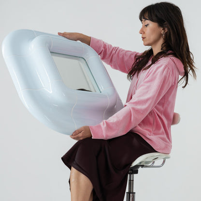 Lolo mirror in ice blue high gloss finished hold by Celia