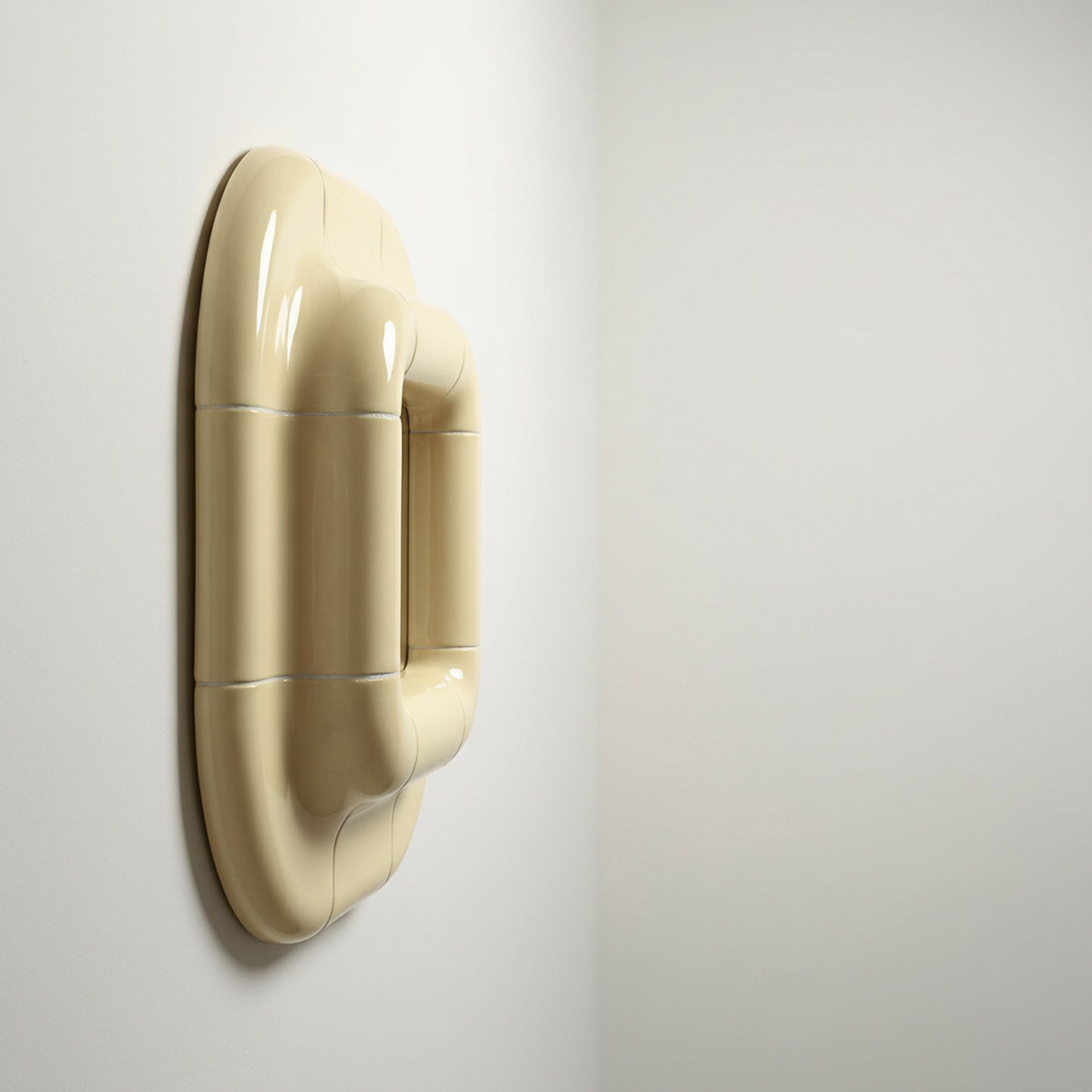 Profile view of Lolo ceramic mirror in Soft Beige by Tilecito, thick rounded tile frame mounted on wall with visible depth and glossy finish