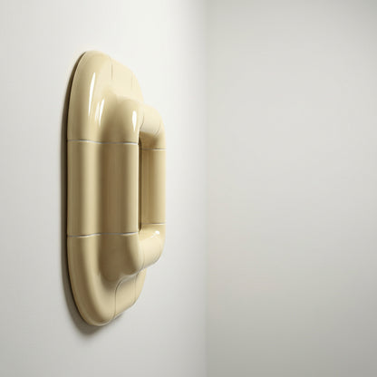 Profile view of Lolo ceramic mirror in Soft Beige by Tilecito, thick rounded tile frame mounted on wall with visible depth and glossy finish