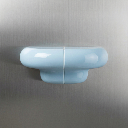 Orbi Shelf in ice blue on steel wall