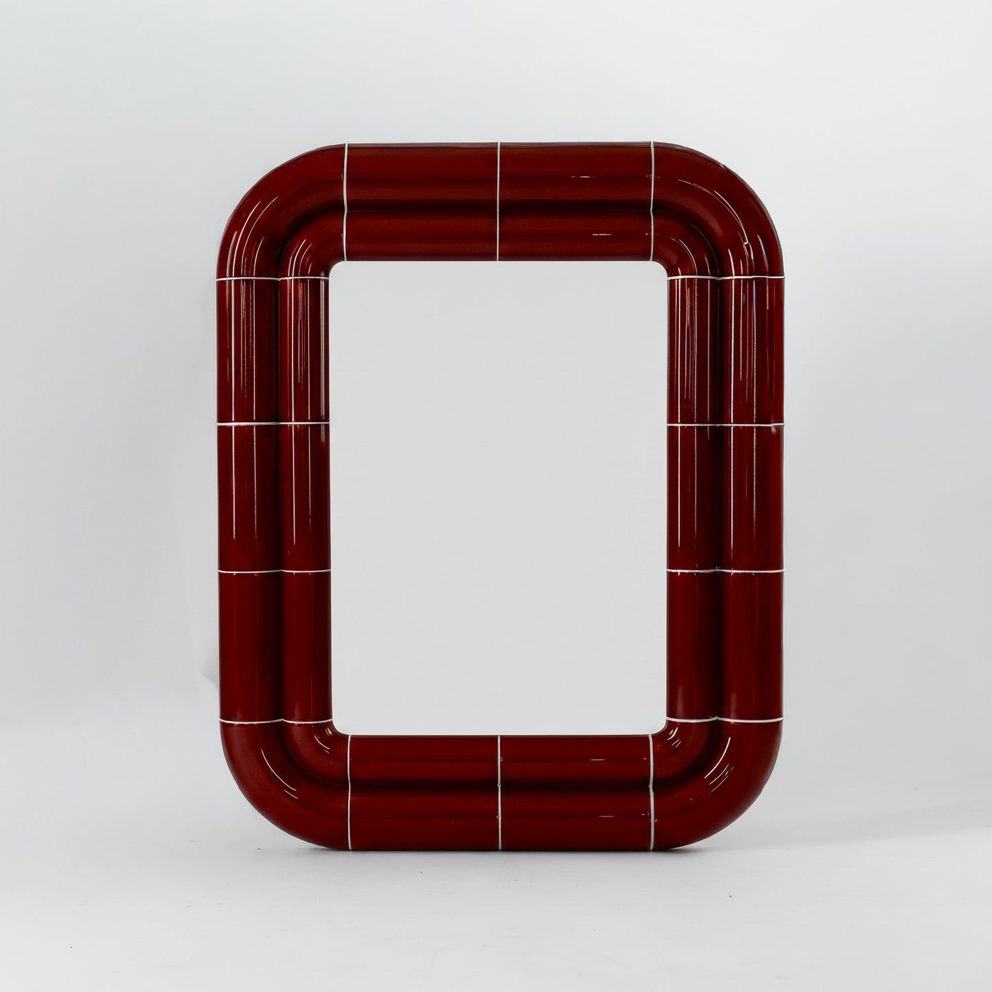 Portalito mirror in Deep Burgundy, square tubular frame with glossy ceramic-like finish, front view