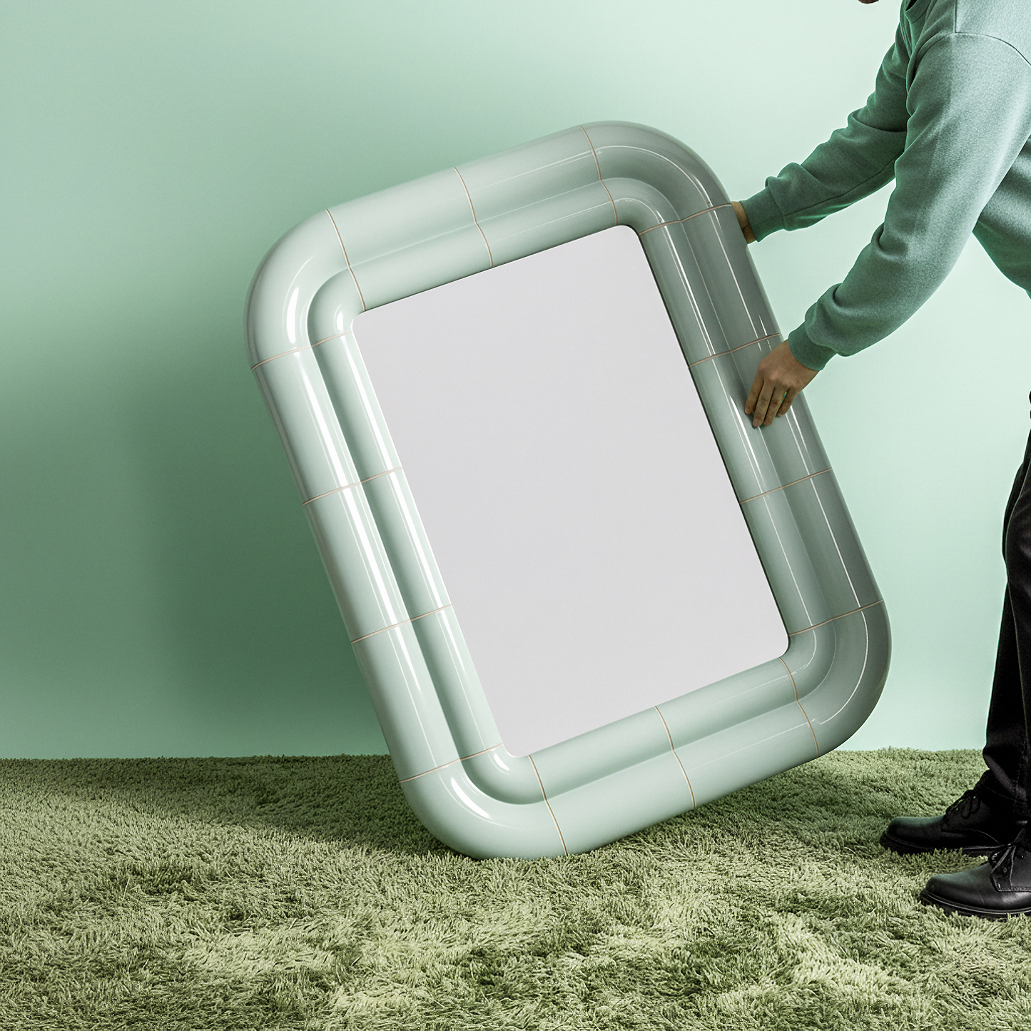 Front view of Portalito — a continuous tubular frame creating depth and softness around the mirror.
