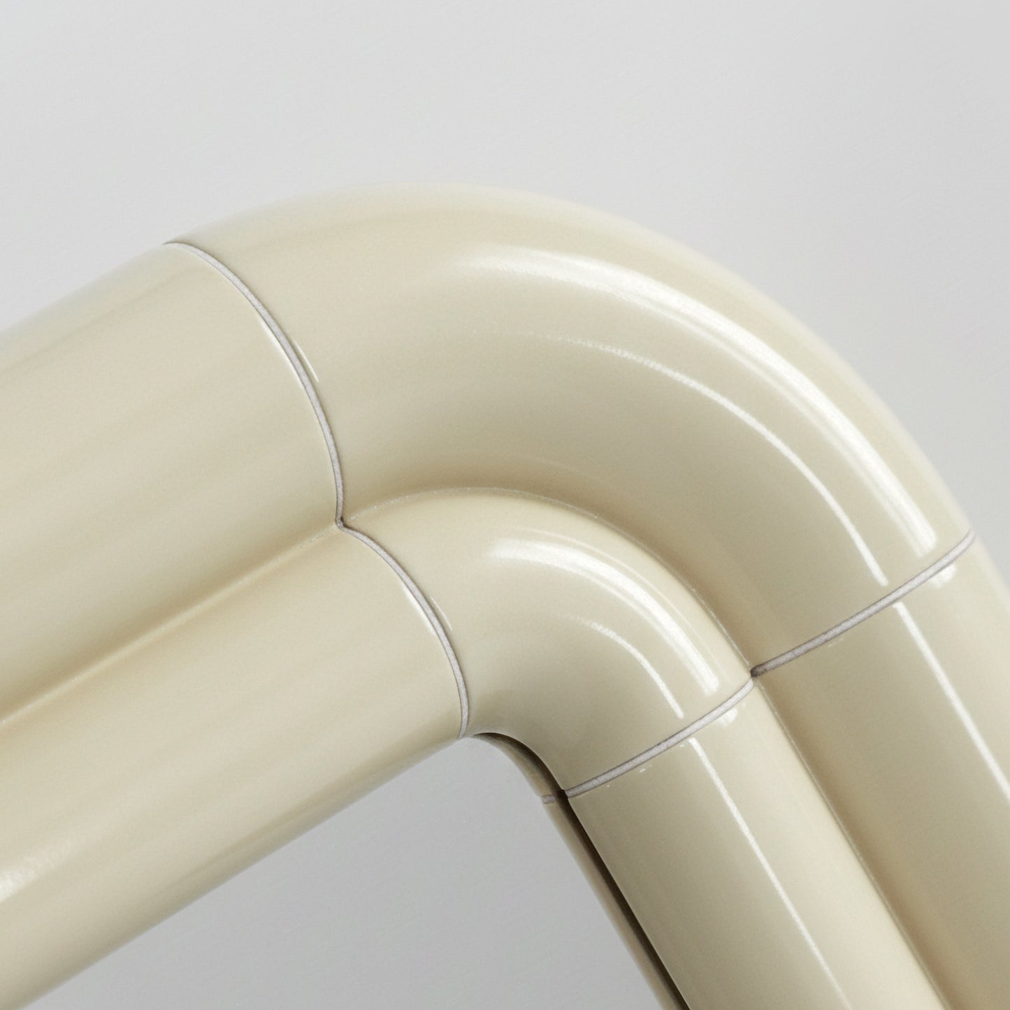 Detail of Portalito frame in Soft Butter, smooth curved surface with visible joints