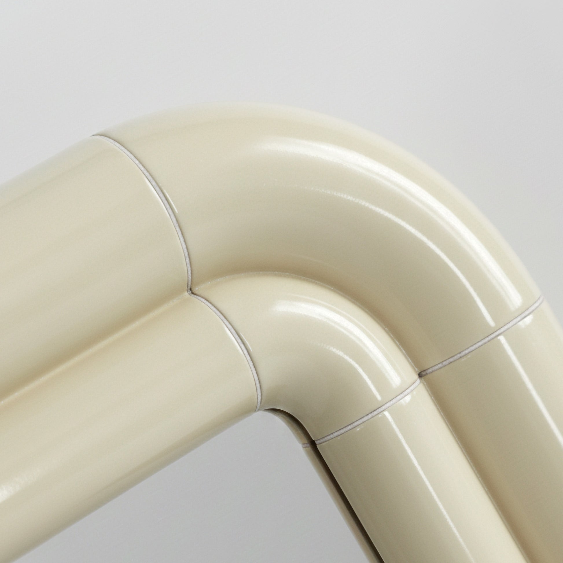 Detail of Portalito frame in Soft Butter, smooth curved surface with visible joints